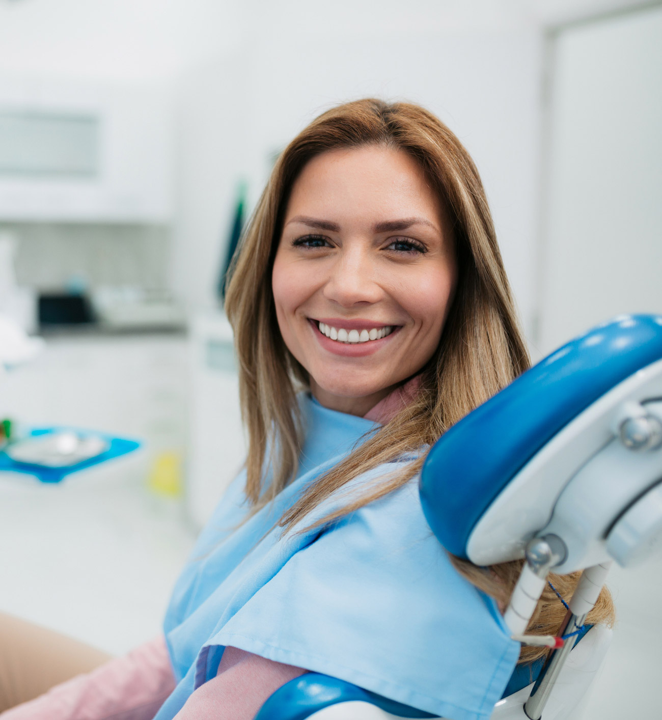 Smiling Woman in Dental Chair